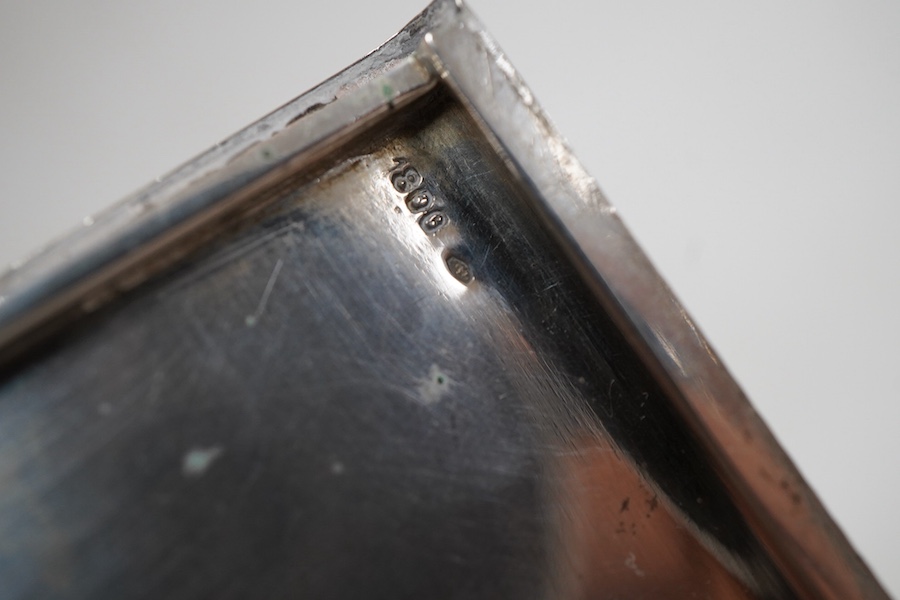 An engine turned 800 standard white metal cigarette case, 12cm, a 1920's Russian 875 standard white metal cigarette case and a white metal paper knife or page turner.